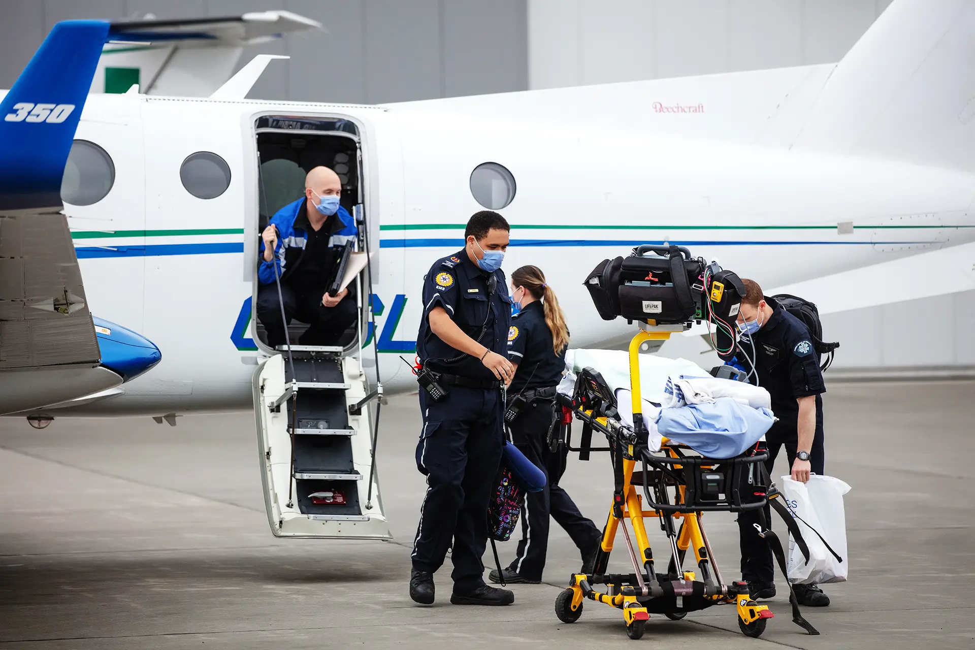 Medical team loading a medical plane